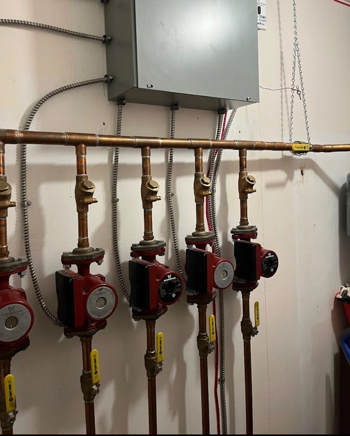 Red circulation pumps and copper pipework
